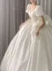 Свадебные платья с причудливым платьем с большим луком