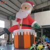 juegos al aire libre actividades decoración navideña gigante inflable al aire libre Papá Noel en la chimenea para publicidad de eventos en el patio inflables