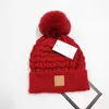 Diseñador Pom Poms Beanie Caps Calidez Sombreros de invierno Hombres Mujeres Bonnet Moda Sombrero de punto Gorro de lana cálido Gorros