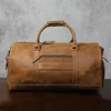 Duffelväskor Män vintage Carry-on Travel Bagage Fullkorn Läder Holdall Helg stor kapacitet över natten axelväska