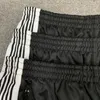 Pantaloni da uomo Aghi Pantaloni sportivi casual Entrambi i lati Nero Bianco Striscia Ricamo classico Uomo Donna All-match Allentato Retro AWGE T290R