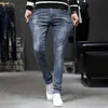 Jeans heren vier seizoenen Koreaanse mode veelzijdige jeugd casual mid rise slank fit kleine rechte elastische broek