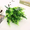 Fiorini artificiali 1pc di vegetazione floreale in finto con piante di plastica di plastica di erba verde foglia foglie foglie foglie false per la decorazione del matrimonio in casa articoli per feste j220906