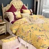 Set di biancheria da letto in stile pastorale francese giallo a fiocco lungo con stampa di fiori in cotone Princess Set copripiumino in pizzo copriletto gonna federe