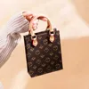 Moda para mujer Hobos blancos Axila Bolsos de un hombro Diseño de lujo Marrón Negro Bolso simple de cuero real Bolsos para chicas jóvenes Bolsos de negocios OL