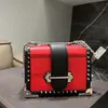 22s Bolso de diseñador Bolsos Bolso de remache de moda Cool Girl Bolsos de hombro Correa de cuero Bolso de mujer Bolso de embrague de diseñador Bolsos cruzados jóvenes Calidad superior S