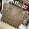 Micro Luggage Bag in Smooth Leather Designer Silver Finishing Hand Carry Smiley Package Women Handbag Studs Base Zipper Closure Tr2672