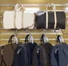 Torby DUFFEL TRADE DUFLE BAG Klasyczna swobodna moda pu skórzana bandouliere luksusowe monogramy torebki Kobiety mężczyźni projektanty luggag świąteczny prezent