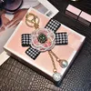 Luxo Pearl Shinny Tassel Black Pink Flowers Keychain Plush Car Camellia Bags Key Chain Key Ring for Women Gift