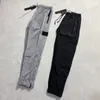 Brand Designers Pants Stone Metal Nylon Pocket Embroidered Badge Casual Trousers Thin Reflective Island Pants 136 423