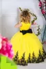 2023 Geel Tule Lace Bloem Girl -jurken voor bruiloft Crew Nek Mouwloze zwarte applique vleugel Bow Long Girls Pageant -jurken BO9374 GB0920