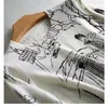 Kvinnors tröjor Raffinerad imitation Wool Knit Tshirt Women's Long Sleeve Top Graffiti Digital Jacquard Pullover Ladies Sweater Summer Thin 220920