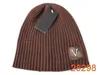 Nouveau luxe tricoté chapeau mode hommes femmes lettre impression chapeau mode conception élastique simple écharpe à carreaux couple multicolore coupe-vent chaud chapeaux