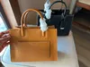 Moda Vintage Totes Duffel Bags Mujeres Bolsos de cuero genuino Hardware de alta calidad