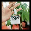 Porte-monnaie de dessin animé mignon PU Owl Design Porte-clés avec pompon Portable Mini Portefeuille Écouteurs Sacs de rangement Mode Porte-clés de voiture Sac Pendentif Gif 2063 E3