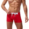 Traje de baño para hombres 2021 Nuevos hombres Boxer Traje de baño Pantalones cortos Color sólido Cintura baja Ropa de playa Moda australiana Traje de baño sexy Verano Spa Playa Surf Deporte J220913