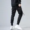 Męskie dżinsy wstążki harem joggers men cargo spodnie streetwear hip -hop swobodny kieszenie na szopce Mężczyzna HARAJUKU Modne spodnie 220920