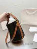 Schoudertassen luxe merk mode eenvoudige bucket tas body met patroon damesontwerper hoogwaardige lederen mobiele telefoon handtassen