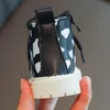 ブーツ子供ショートガールズファッションオールマッチウェーブポイントシングルボーイズノンスリップ黒と白のミッドチューブ220921