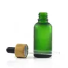 空の化粧品ガラスドロッパーボトル30mlエッセンシャルオイルボトルフロストクリアアンバーブルーグリーンと竹の帽子
