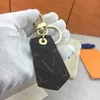 Nuevo llavero de cuero bucle de llave para hombre diseñador de llave llave anillo de llavero llavero marrón negro accesorios de bolsas de automóviles