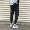 Męskie dżinsy wstążki harem joggers men cargo spodnie streetwear hip -hop swobodny kieszenie na szopce Mężczyzna HARAJUKU Modne spodnie 220920