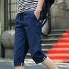 Мужские шорты мужчины в корейском стиле эластичные брюки талии сплошные шнурки с прямыми укороченными штаны расслабленные шнурки короткие шнурки короткие