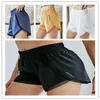 Kvinnors sp￥rs￤ttningar L124 Womens Yoga Shorts Pants Pocket Quick Dry Gym Sport outfit h￶gkvalitativ stil Summerkl￤nningar Elastiska midja Rinnande kl￤der291g