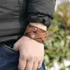 Bloque de cuero Brazalete cruzado Brazalete Botón ancho Pulsera ajustable Muñequera para hombres Mujeres Joyería de moda