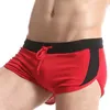 Menas de banho masculinas Sexy mass de cintura baixa shorts divididos esportes de corrida de corrida masculino macacão respirável academia gym g string calças j220913