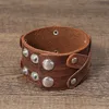 Bloque de cuero Brazalete cruzado Brazalete Botón ancho Pulsera ajustable Muñequera para hombres Mujeres Joyería de moda