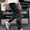 デザイナーの男性カーゴパンツオーバーオSY3ブラックスポーツカジュアルスリムズボンナイロンとポケット付き