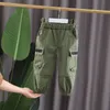 春の秋のファッション新しい子供綿服ベイイズボーイズガールズエラスティックポケットワークワークワークズボンキッズ幼児カジュアルスポーツパンツ