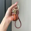 Chave de futebol da Copa do Mundo Chaves de futebol de futebol Fashion Fashion requintado Keyring Bag feminino São pequenas lembranças de pendentes