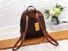 Marca 2023 Mochilas masculinas Bolsa feminina Bolsa de couro Design Moda Brown Letter Bolsa Crossbody 27x14x129cm283r