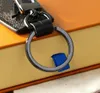 Modischer Schlüsselanhänger aus Edelstahl für Taschenliebhaber, Auto-Schlüsselanhänger, manuelles Leder, glatte Oberfläche, Herren- und Damen-Geldbörsen-Anhänger, Liebhaber-Zubehör
