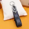 Nouveau designer couple Keychain Unisexe Key Buckle Car Sac Pendentif Pendre Mobile Phone Pendants Men Femmes en cuir Chain de cuir 8273476