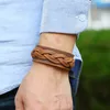 Etnisk Braid Leather Bangle Cuff -knapp Justerbar armband ORSBED FÖR MÄN KVINNA MODEMEDLIGHETER