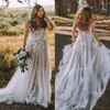 Abiti da sposa a-line bohémien Senza spalline Abiti da sposa lunghi in tulle Applicazioni in pizzo Backless Country Boho Sposa Robe De Mariage Fodera nuda scura Personalizzata