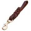 Colliers pour chiens Laisses Une étape Laisse courte pour chien Tressé Ceinture de traction en cuir véritable Antidéflagrant pour animaux de compagnie Laisse d'entraînement à la marche pour chiens de taille moyenne et grande 220923