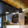 ペンダントランプは、バーコーヒーショップのシンプルなスポットライトパーソナリティブラックベッドルームの小さなろうそくのためのクリエイティブライトをリードしています