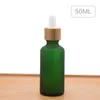 15ml 20 30ml Botella cuentagotas de vidrio verde esmerilado con tapa de bambú Botella de vidrio de aceite esencial 30ml