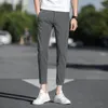 Мужские брюки мужчины 2022 весенняя осенняя мода тонкие шелковые шелковые брюки мужские эластичные карандаш. Случайные быстроотлитые A223