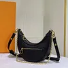 Designer uma bolsa de ombro de ombro Bola feminina Bolsa de metal vintage Bolsa de travestis Bolsa Crossbody Bolsa Lua Zipper Marelle Pea Pães