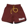 Rhude Men Designer New Fashion Summer Mens Shorts Spectpants Phoint Women مصمم سراويل قصيرة للجنسين رسائل مطبوعة Mens Beach Pant