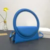 Bolsas de noite Bolsas de grife femininas Bolsas de moda Bolsa de ombro Bolsas redondas de luxo de alta qualidade Alças de anel Batom de couro Bolsas de cosméticos