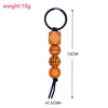 Träpärlad nyckelring Pendant Sport Basketboll Fotboll Baseball Tassel Keychains Träpärla Key Chain Keyring FY3942 P0928