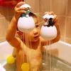 Bébé natation salle de bain baignade de douche de douche en enfants pingouin d'oeuf à l'oeuf saupoudrer saupoudrer d'horloge