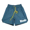 Rhude Men Designer New Fashion Summer Mens Shorts Spectpants Phoint Women مصمم سراويل قصيرة للجنسين رسائل مطبوعة Mens Beach Pant