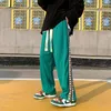 Calças masculinas 2022 hip hop cintura elástica casual solta verde/branco/preto calça de moletom joggers moda calças decoradas com correias M-3XL